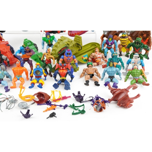 1303 - A collection of vintage He-Man action figures, vehicles and accessories, some by Mattel.