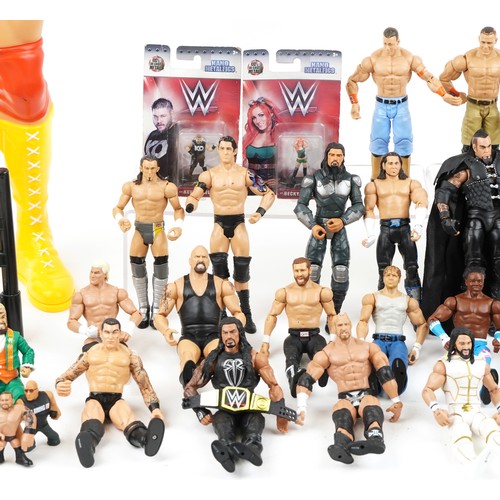 1322 - A collection of vintage World Wrestling action figures and accessories together with two crash cages... 