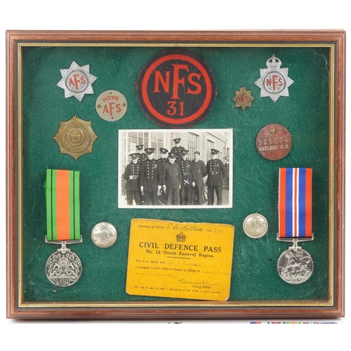 2426 - Militaria including a framed set of World War II medals, badges and Civil Defence Pass number 12 Sou... 