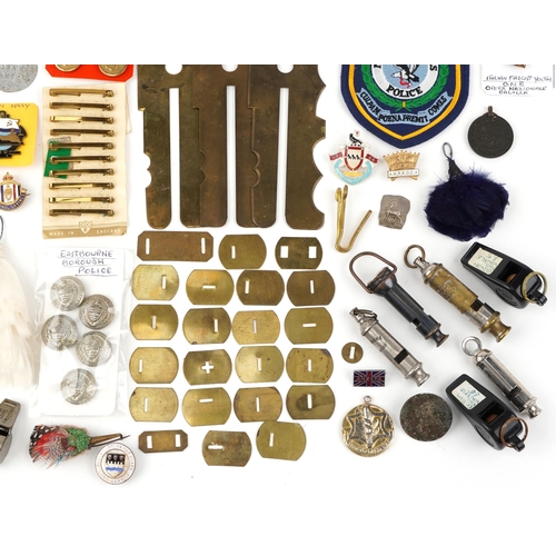 2477 - Militaria including British military issue uniform button cleaning tools, ACME whistles, British Rai... 