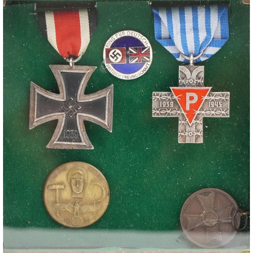 2543 - Three German military interest medals and two badges including an Iron Cross.