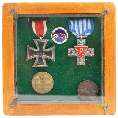 2543 - Three German military interest medals and two badges including an Iron Cross.