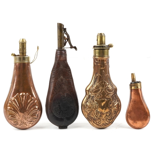 2466 - Three military interest copper powder flasks and an embossed leather powder flask, the largest 22cm ... 