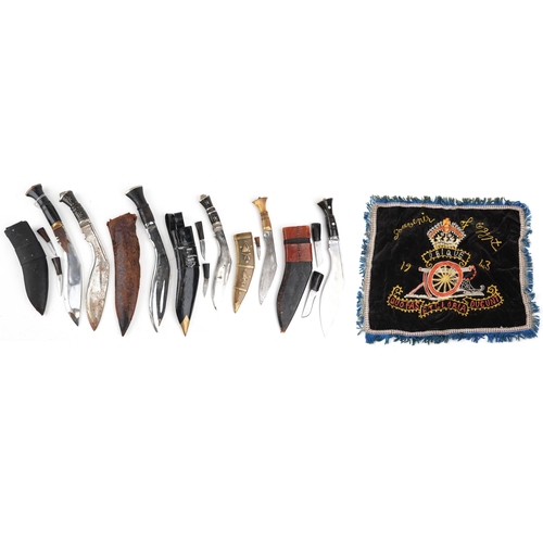 2606 - Six Gurkha's Kukri knives, five with sheaths, together with an embroidery, the largest 44cm in lengt... 