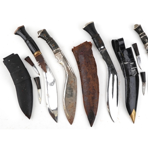 2606 - Six Gurkha's Kukri knives, five with sheaths, together with an embroidery, the largest 44cm in lengt... 