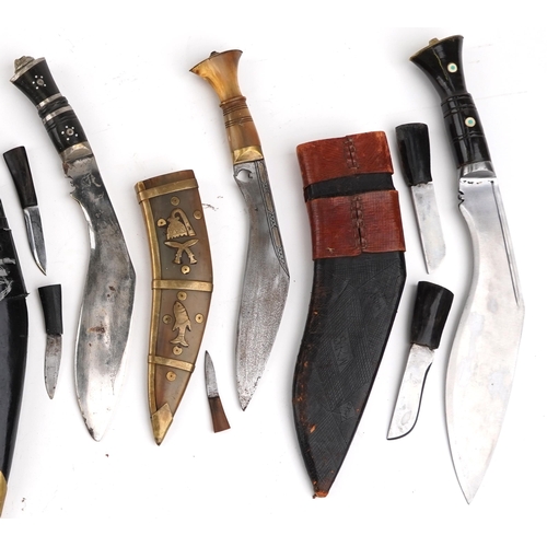 2606 - Six Gurkha's Kukri knives, five with sheaths, together with an embroidery, the largest 44cm in lengt... 