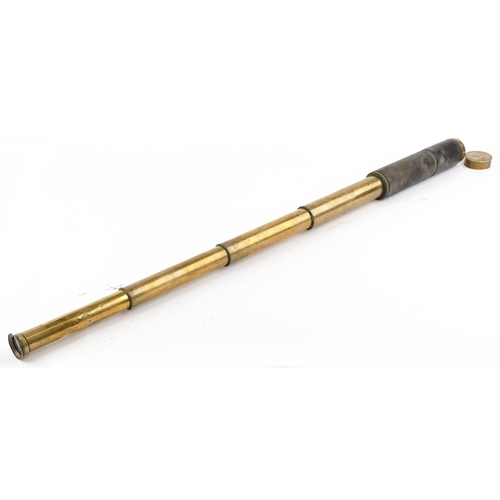 2464 - A naval interest brass four draw telescope, 108cm in length extended.