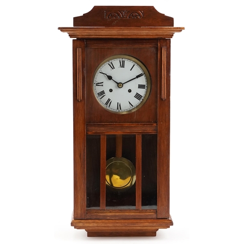 1408 - A Vienna style walnut wall clock with Roman numerals, 71cm high.