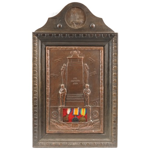 A British military World War I medal trio and death plaque housed in a cast metal and carved oak frame inscribed The Glorious Dead, the Path of Duty Was the Way to Glory, the medals awarded to 38007 SPR.W.H.C.MURPHY.R.E., the death plaque awarded to William Henry Cook, overall 75cm x 44cm.