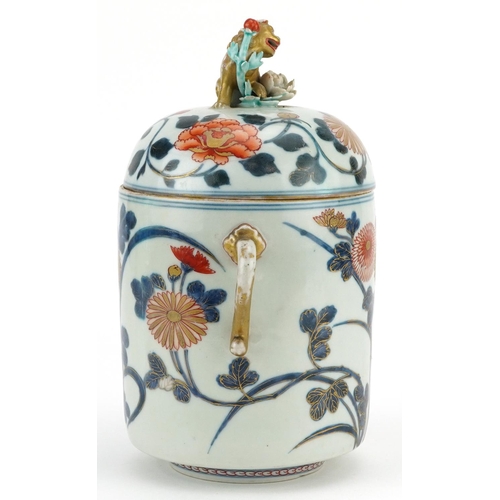  A Japanese Imari porcelain lidded jar, Meiji period, the lid mounted with a temple dog, 23cm high x ... 