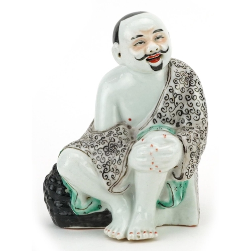 339 - A Chinese porcelain figure of a seated man, 20th century, 19cm high.