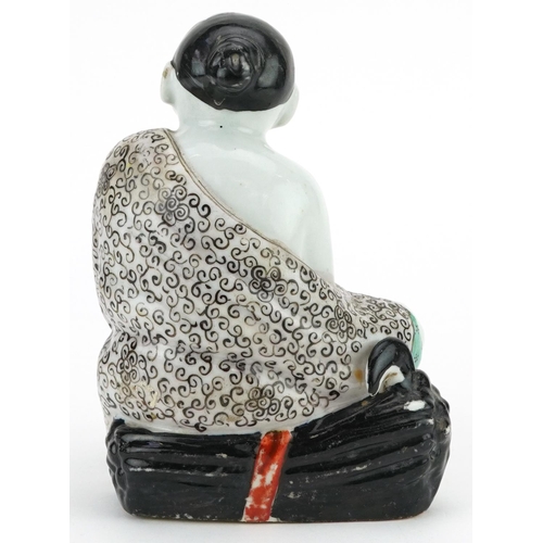 339 - A Chinese porcelain figure of a seated man, 20th century, 19cm high.