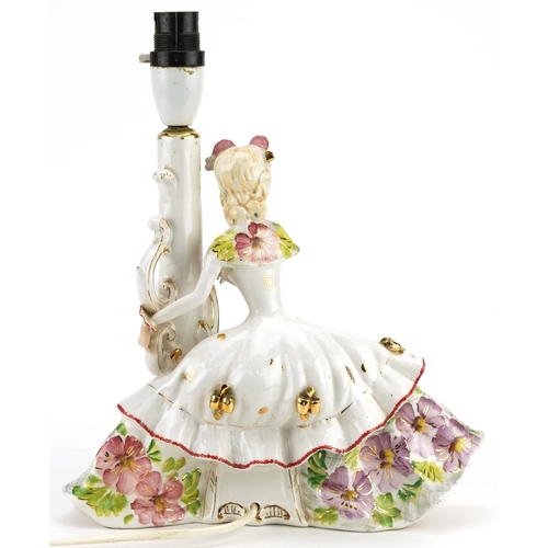 1515 - A 20th century Italian porcelain lamp base modelled as a lady in a large dress, signed to the base, ... 