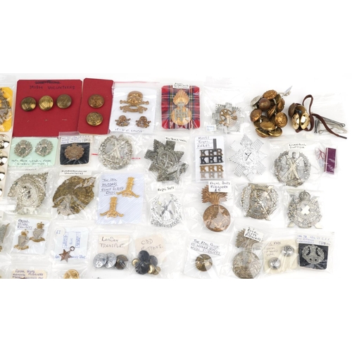 2496 - A collection of military interest cap badges and collar badges including Royal Highland Fusiliers, R... 