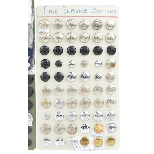 2512 - A collection of military, police and fire service uniform buttons including Royal Engineers, 17th La... 