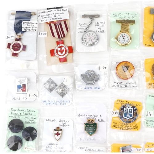 2303 - A collection of nursing related badges, buttons and watches including London County Council Home Nur... 