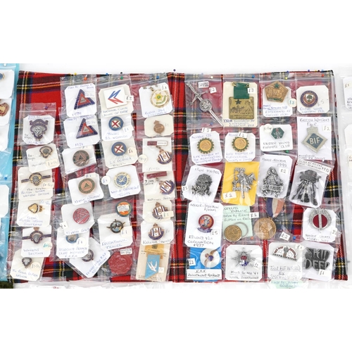 2304 - A large collection of vintage and later badges, some advertising, including Rupert, Robertson figure... 