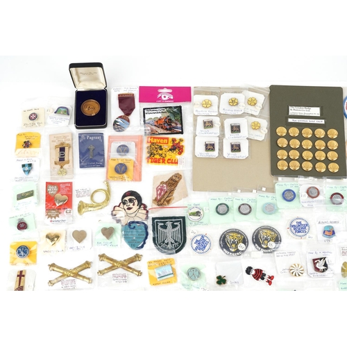 2305 - A large collection of vintage and later badges and buttons, some advertising, including Winnie the P... 