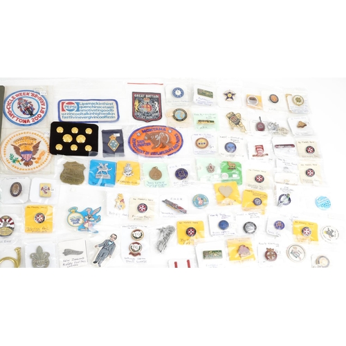 2305 - A large collection of vintage and later badges and buttons, some advertising, including Winnie the P... 