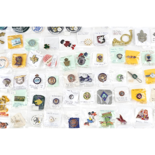 2305 - A large collection of vintage and later badges and buttons, some advertising, including Winnie the P... 