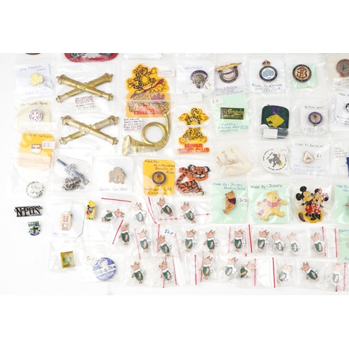 2305 - A large collection of vintage and later badges and buttons, some advertising, including Winnie the P... 