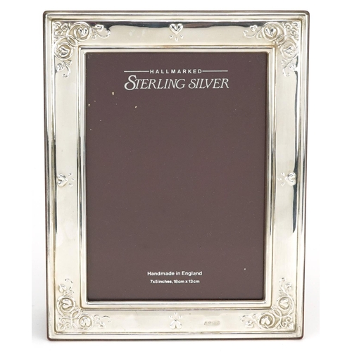 589 - Carrs, rectangular silver easel photo frame embossed with vines and love hearts with box, Sheffield ... 