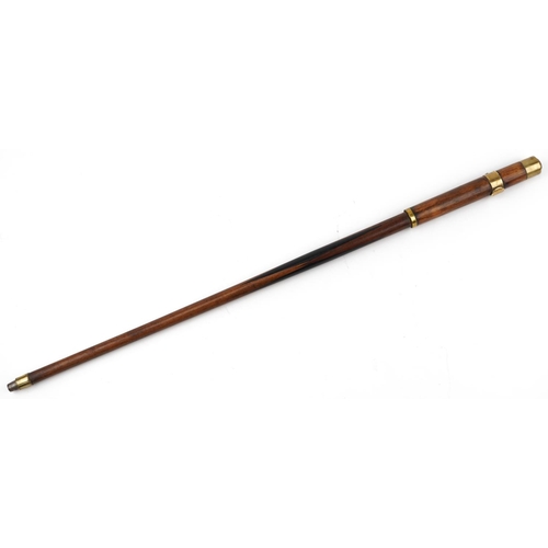 228 - A 19th century mahogany propelling swordstick with brass mounts and ebonised decoration, 90cm in len... 