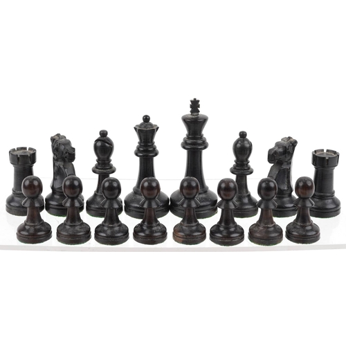 1244 - A boxwood and ebony Staunton pattern chess set with weighted bases housed in a Staunton box, the lar... 