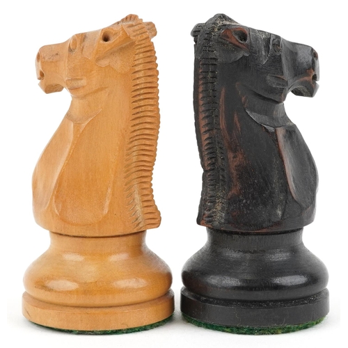 1244 - A boxwood and ebony Staunton pattern chess set with weighted bases housed in a Staunton box, the lar... 