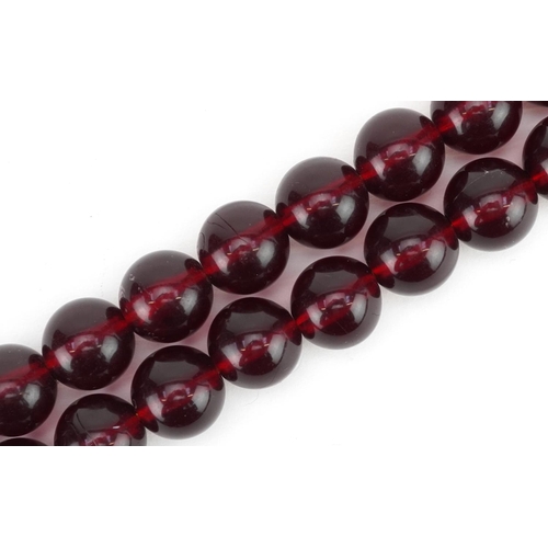 3314 - A vintage dark red bead necklace.