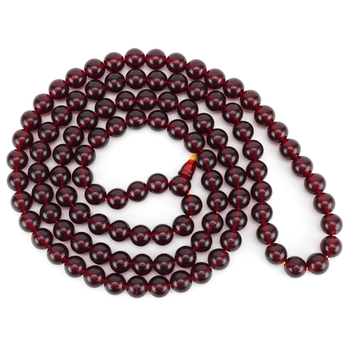 3314 - A vintage dark red bead necklace.