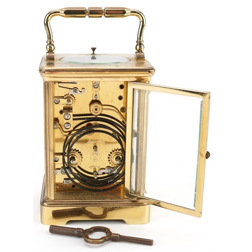 63 - An early 20th century gilt brass cased repeating carriage clock by L'Epee Saint Luxanne France, the ... 