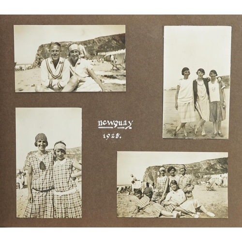 2321 - An early 20th century photograph album containing black and white holiday photographs from around th... 