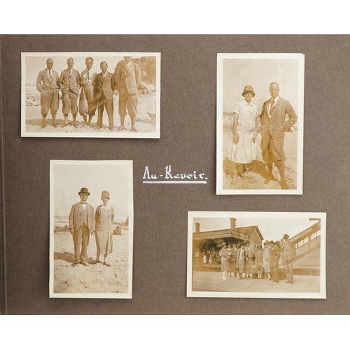 2321 - An early 20th century photograph album containing black and white holiday photographs from around th... 