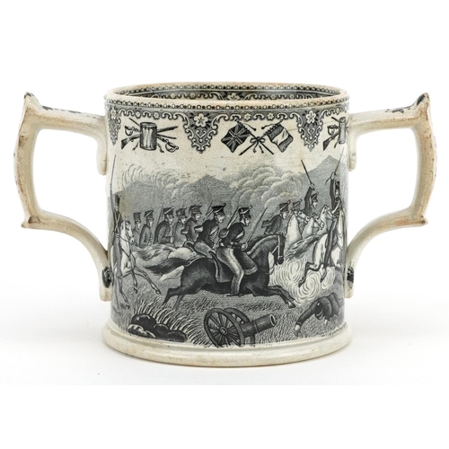  A mid Victorian Staffordshire pottery two handled mug decorated with scenes from the Crimean War, 11... 