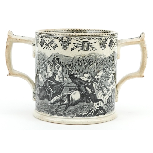  A mid Victorian Staffordshire pottery two handled mug decorated with scenes from the Crimean War, 11... 