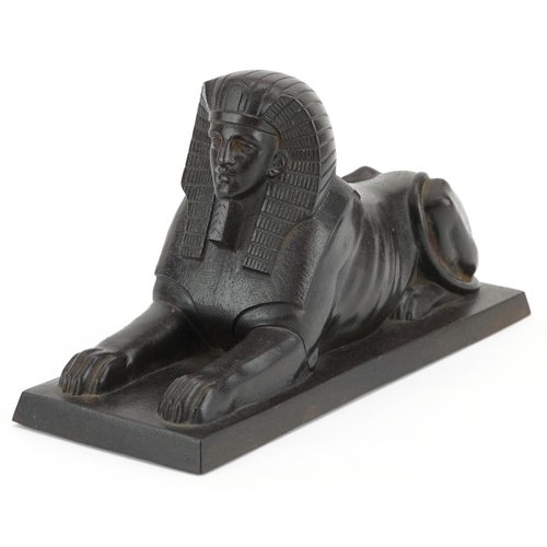 70 - A Hanau cast iron figure of a recumbent Sphinx, early 19th century, The E.G. Zimmermann Foundry, 23c... 