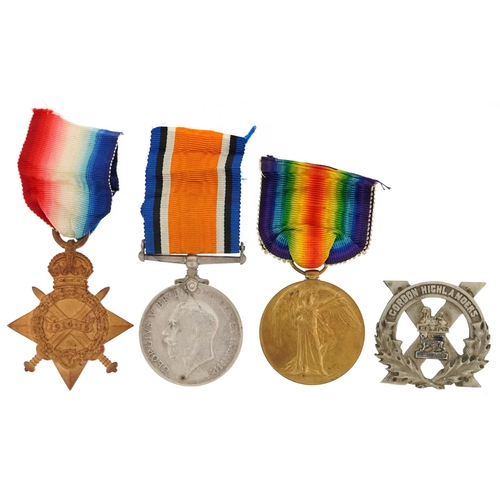 2406 - A British military World War I medal trio awarded to S-7534 PTE.R.FLETCHER.GORDONS together with a G... 