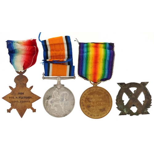 2406 - A British military World War I medal trio awarded to S-7534 PTE.R.FLETCHER.GORDONS together with a G... 