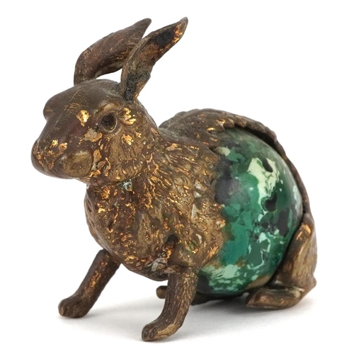 9 - A novelty antique tape measure in the form a rabbit with tail winder, 5.5cm in length.