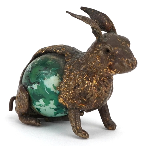 9 - A novelty antique tape measure in the form a rabbit with tail winder, 5.5cm in length.