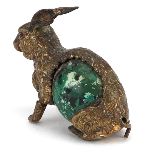 9 - A novelty antique tape measure in the form a rabbit with tail winder, 5.5cm in length.