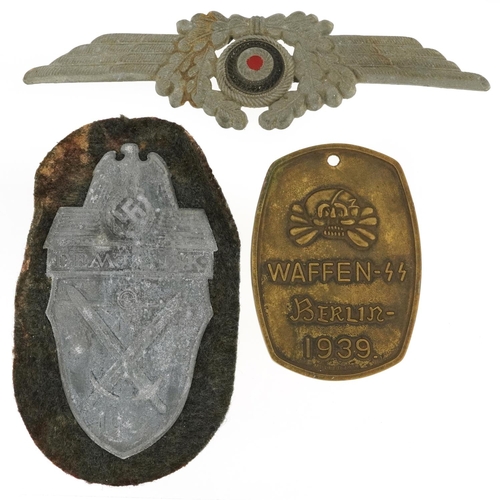 2557 - Three German military interest cap badges.