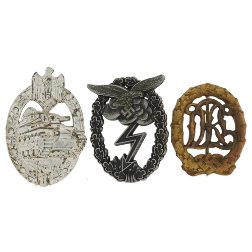 2556 - Three German military interest cap badges.