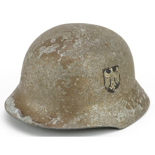 2576 - A miniature German military interest wedding tin helmet with twin decals, 9.5cm in length.