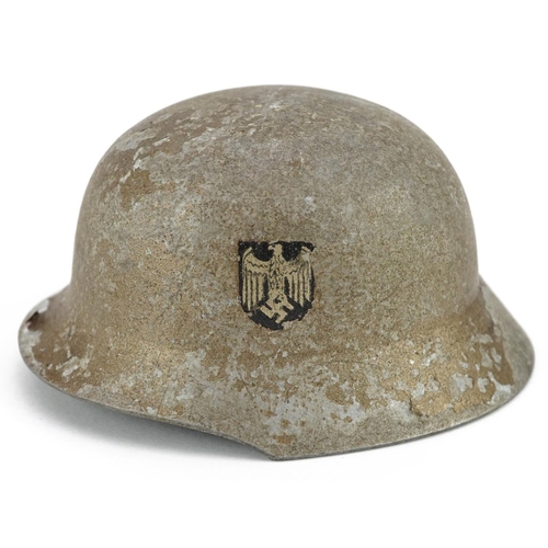 2576 - A miniature German military interest wedding tin helmet with twin decals, 9.5cm in length.