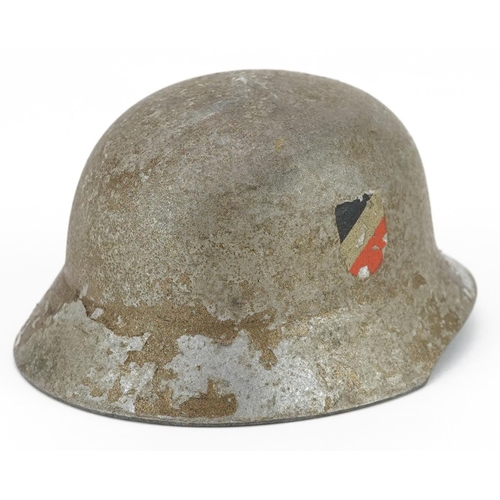 2576 - A miniature German military interest wedding tin helmet with twin decals, 9.5cm in length.