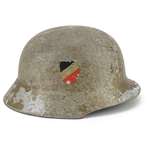 2576 - A miniature German military interest wedding tin helmet with twin decals, 9.5cm in length.