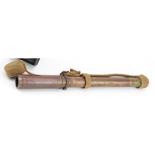 2468 - A military interest brass telescope and bicycle lamp, the telescope 34cm in length.