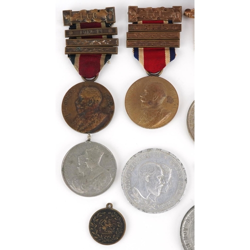 2433 - A collection of commemorative medallions and awards including The King's Medals for Attendance award... 